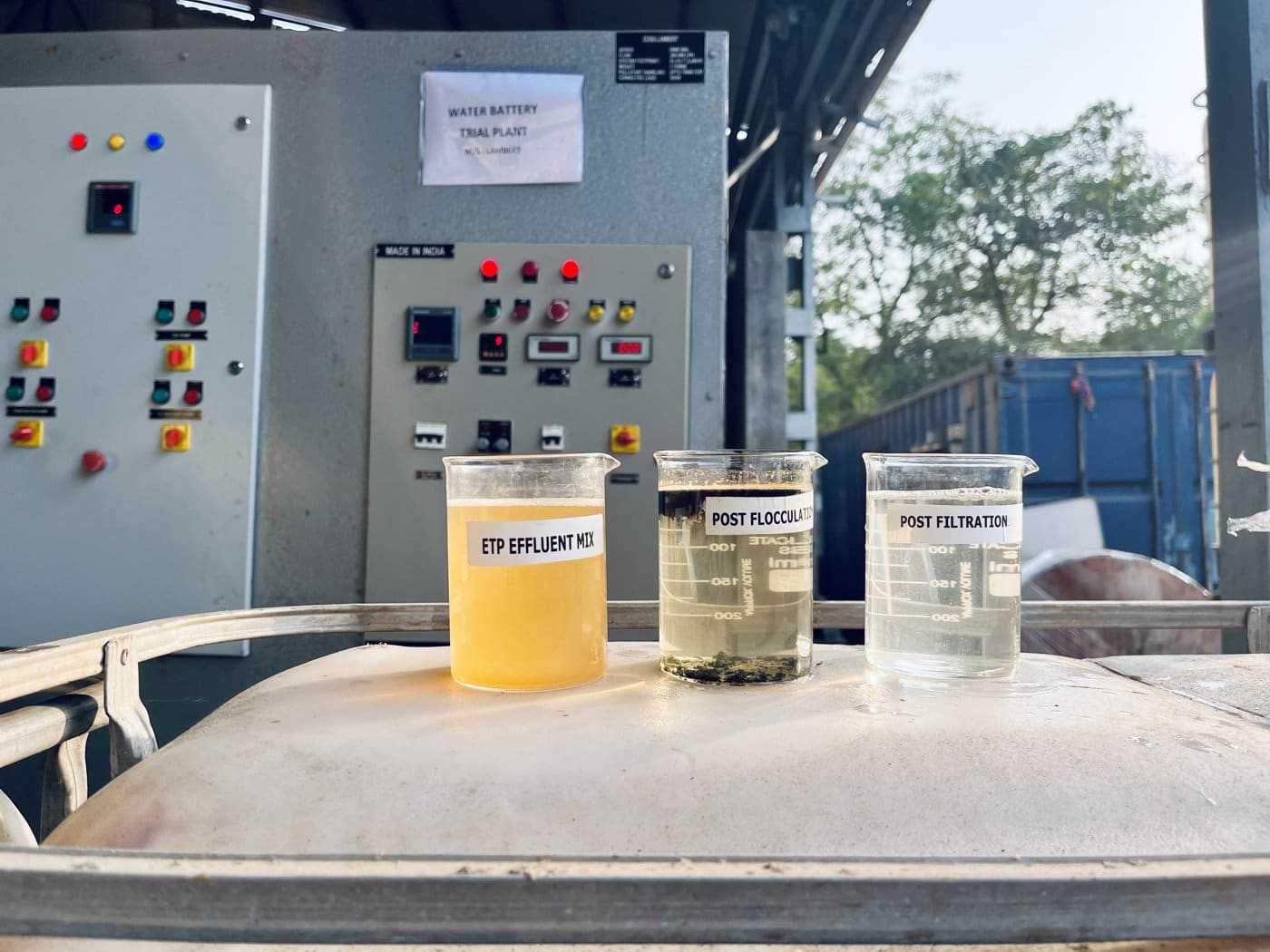 Lambert engineers validating electrochemical reactor performance on labeled beakers